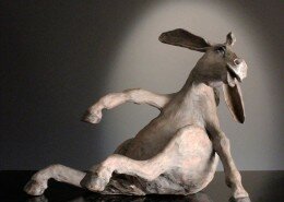 Julie Kradel Clay Artist in Cedar, MI creates sculptures inspired by the animals on her farm and their beautiful balance between strength and vulnerability