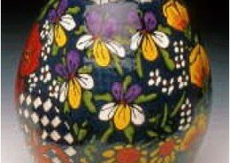 John Garland and Mary Paul, potters, create colorful nature or figurative patterns and designs on functional earthenware pottery at Freechild Studios, NC.