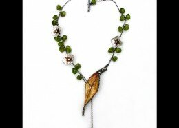 Kristi Hyde, Jeweler in Atlanta, Georgia, hand sculpts, polishes and finishes earrings, bracelets and necklaces with botanical designs inspired by nature.