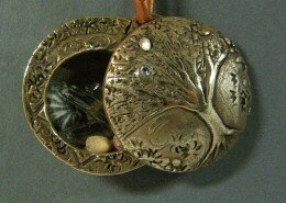 Janet Harriman, Jeweler in North Carolina, hand crafts pieces through forming, texturing and soldering silver or gold and adding enamel, natural gemstones or pearls.