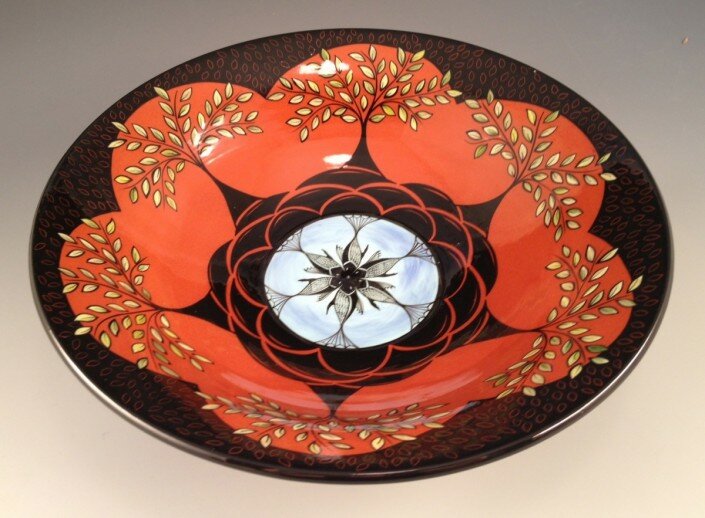 Marti Mocahbee creates clay teapots, bowls, cups and saucers, plates, vases and lidded jars inspired by cultural and historical influences, color and form.