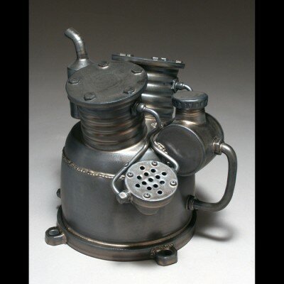 Paveen Beer Chunhaswasdikul of Beer Pottery in AL, creates unique pottery called metal ware along with teapots, pitchers, tumblers, mugs and lidded jars.