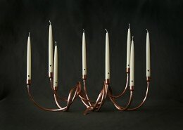 Cathy Vaughn Metalworker in VA cuts, bends, fits, solders and finishes copper tubing and piping sculptures and functional pieces for the home and garden.