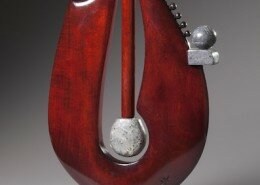 Michael Costello Mixed Media Artist in Willis, VA hand carves hardwoods and combines carved stone weights to create elegant kinetic and static sculptures.