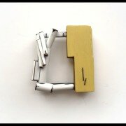 Lauren Markley, Jeweler in Raleigh, NC creates one-of-a-kind jewelry pieces utilizing sterling silver, brass, reclaimed wood, thread and painting.