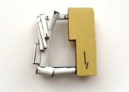 Lauren Markley, Jeweler in Raleigh, NC creates one-of-a-kind jewelry pieces utilizing sterling silver, brass, reclaimed wood, thread and painting.