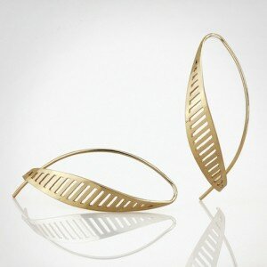 Nancy Ryall Jeweler in Oxford, NC, creates jewelry from sterling silver and 14k gold with highly polished surfaces, contrasting textures and finishes.