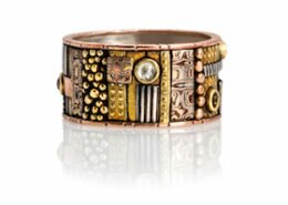 Lynda Bahr, Jeweler in San Gregorio, CA, creates one-of-a-kind rings, earrings and bracelets with mosaics of sterling silver, golds and precious stones.