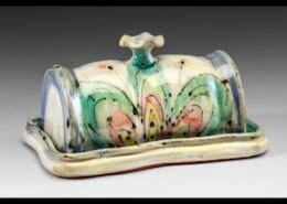 Elise Pincu Delfield, potter in Bryson City, NC, hand-builds or throws on the wheel functional pottery inspired by blooming mountain flowers and butterflies